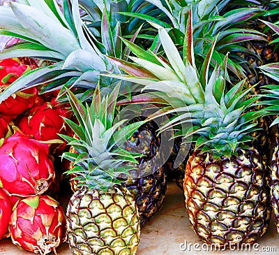 Pineapple and Dragonfruit on farmers market table Stock Photo