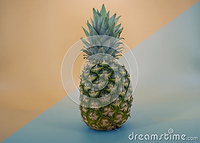 Fresh Pineapple fruit ,modern backraund orang blue Stock Photo