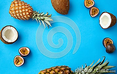 Pineapple, passion fruit and coconut on blue Stock Photo