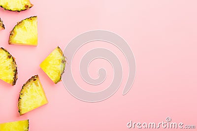 Pineapple slices on a pink background. Tropical juicy exotic healthy fruit. Copy space, top view, flat lay Stock Photo