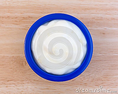 Pineapple yogurt in a blue dish on table Stock Photo