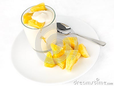 Pineapple yogurt with pineapple chunks Stock Photo