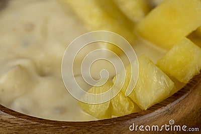 pineapple yogurt with slices of ripe yellow pineapple pineapples with fresh yogurt Stock Photo