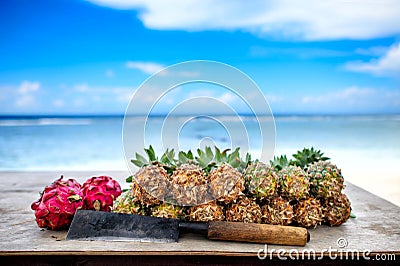 Pineapples and dragon fruit with machete Stock Photo