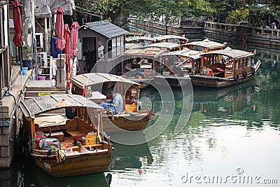 Figures in boats Pingjiang Road, Gusu District, Suzhou, China with canal Editorial Stock Photo