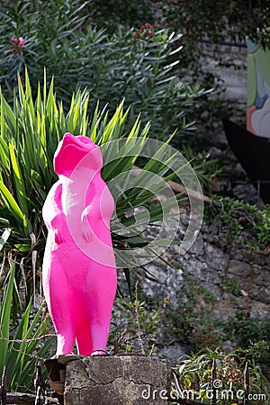 Pink animal statue in the park of Portofino harbor in Italy Stock Photo