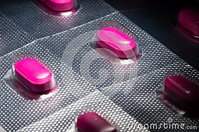 Pink antihistamine allergy tablets in blister pack Stock Photo
