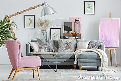 Pink armchair on grey carpet Stock Photo