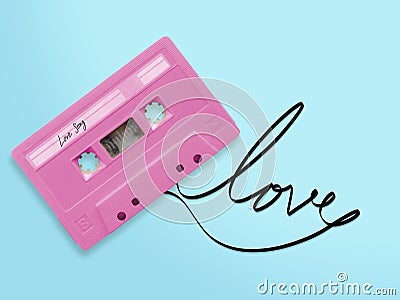 Pink audio cassette tape with label tag love song tangled tape Stock Photo