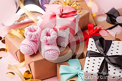 Pink baby shoes for little girl in gift box - concept of first step, birthday party, baby shower, anniversary. Gift and present Stock Photo