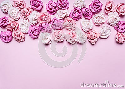 Pink background with colorful paper roses decorations Valentine's Day border ,place text top view close up Stock Photo