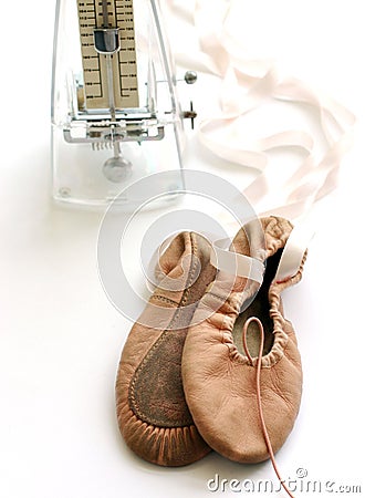 Pink ballet shoes, metronome Stock Photo