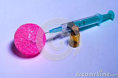 Pink balloon, syringe and small vial. Concept of vaccination, anti-virus. Close-up. Selective focus Stock Photo