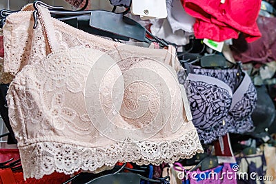 Pink beige sexy lace bra in a showcase of lingerie store Stock Photo