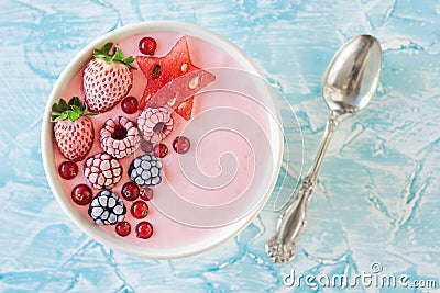 Pink Berry Yogurt Smoothie Bowl with Fruit Stock Photo