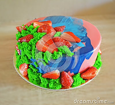 Pink and blue mirror glaze mousse cake with berries and sponge bisquit. Homemade strawberries cake Stock Photo