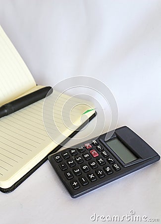 One pencil, notebook and a calculator Stock Photo