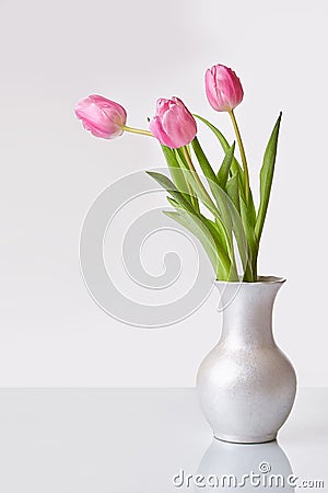 Pink bouquet of tulips in a vase Stock Photo