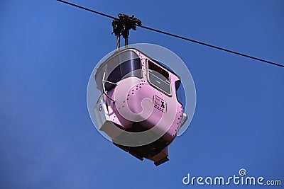 Pink cable car gondola, labeled with `sweet kitten` and decorated with cats and cat paws. Editorial Stock Photo