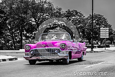 Pink cabriolet classic car on the Malecon in Cuba Havana Editorial Stock Photo