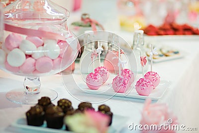 Pink cake pops on a dessert table Stock Photo