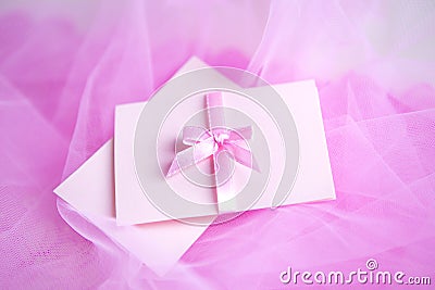 Pink cardboard with satin bow Stock Photo