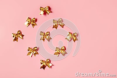 Pink celebration background with golden bow Stock Photo