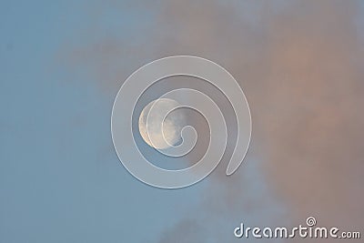 Morning moon in pink clouds Stock Photo