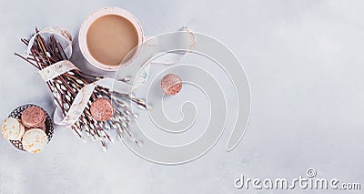 Pink coffee mug with sweet pastel french macaroons and wil Stock Photo
