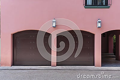 Pink colored house with two car garage Stock Photo