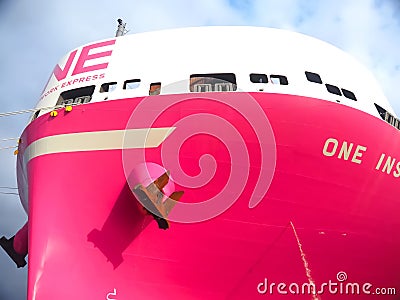 Pink container ship ONE inspiration of the shipping company Ocean network express at terminal Burchardkai at the port oh Hamburg Editorial Stock Photo