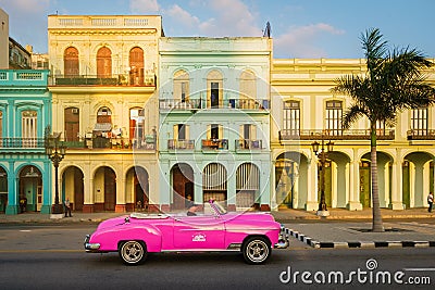 Pink convertible car and colorful buildings in Havana Editorial Stock Photo