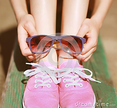 Pink cool girl, gumshoes and sunglasses, fashion, summer Stock Photo
