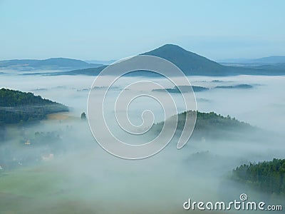 Pink daybreak, dark forest hills.. Chilly fall atmosphere in countryside. Cold and damp autumn morning. Stock Photo