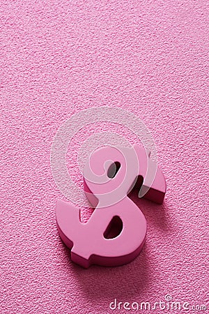Pink dollar sign on a pink background Stock Photo
