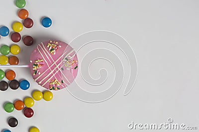 Pink donut with candy in left bottom Stock Photo