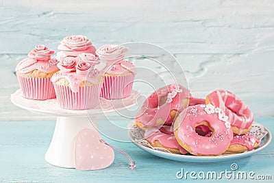 Pink donuts and cup cakes Stock Photo