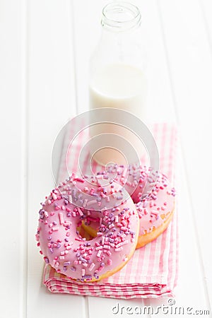 Pink donuts and milk bottle. Stock Photo