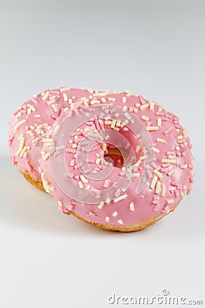 Pink donuts with sprincles on white Stock Photo