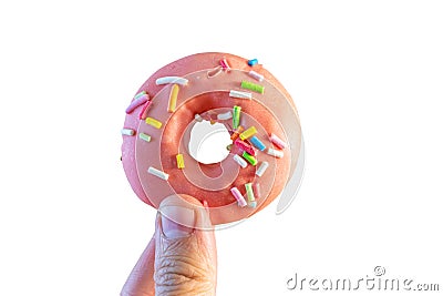 pink doughnut in a woman's hand Stock Photo