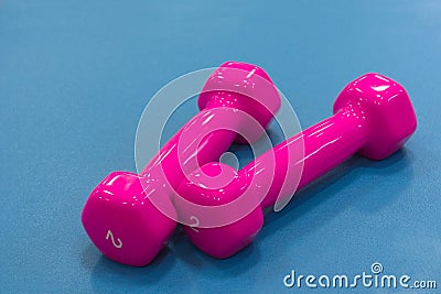 Pink dumbbells for fitness Stock Photo