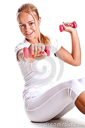 Pink dumbbells in the hands of women Stock Photo