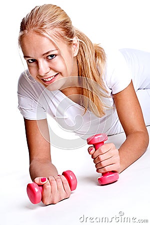 Pink dumbbells in the hands of women Stock Photo