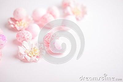 Pink Easter eggs and flowers on white background Stock Photo