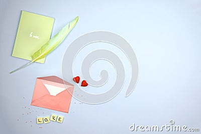 Pink envelop with love letter be mine on pastel flat lay background, valentine\'s day red hearts composition with notebook and Stock Photo