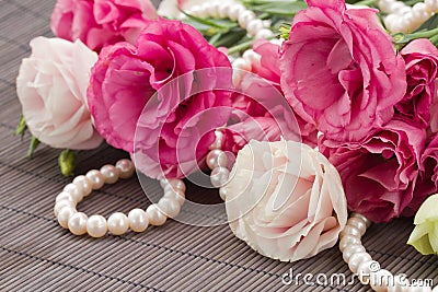 Pink eustoma flowers and pearls border Stock Photo