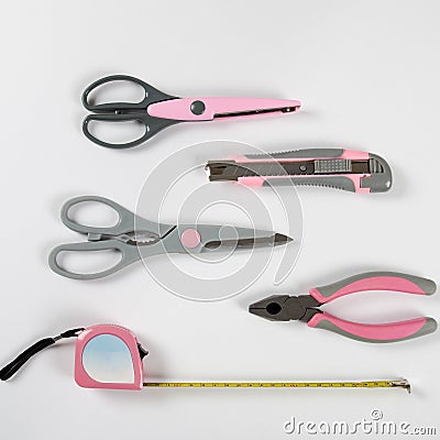 Pink feminine handy tools on a white background Stock Photo