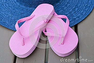 Pink Flip Flops and Blue Straw Hat Stock Photo