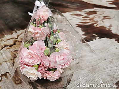 pink flower bouquet on wet wood Stock Photo