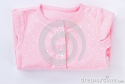 Pink folded baby pajamas isolated on white. Stock Photo